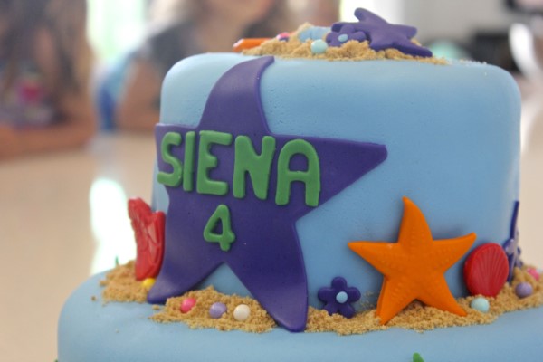 Image of birthday cakes decorated with a sea and beach theme for a little girl's celebration.
